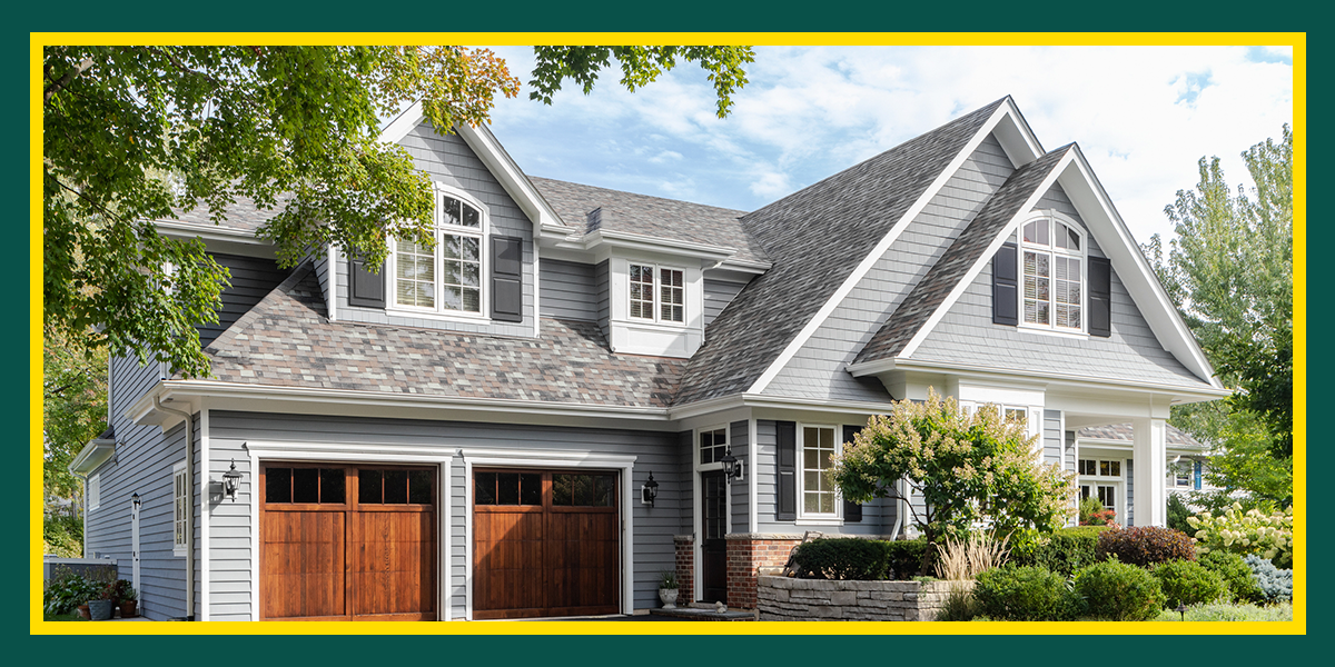 Wooden Garage Doors on a Grey House